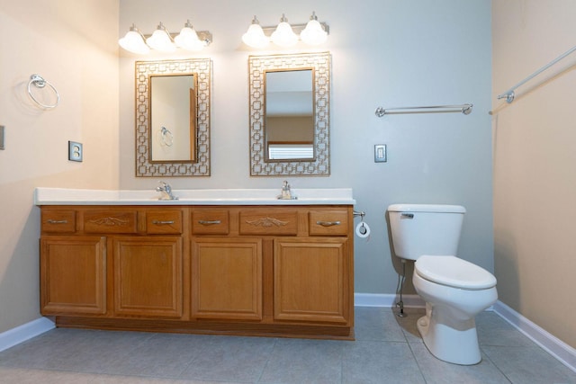 bathroom with double vanity, baseboards, toilet, and tile patterned flooring