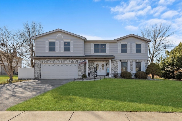 view of front of house with aphalt driveway, a garage, brick siding, and a front yard