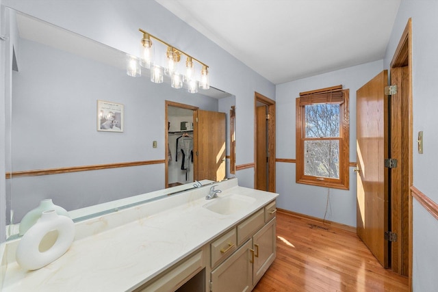 bathroom featuring vanity and wood finished floors