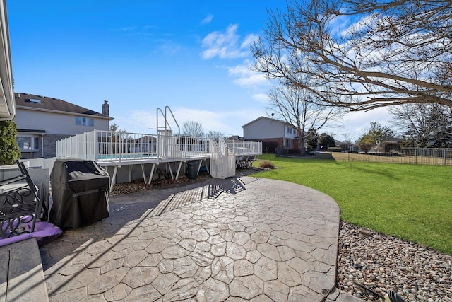 view of patio / terrace featuring area for grilling, a wooden deck, and fence