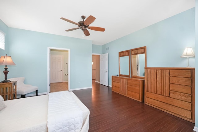 bedroom with ceiling fan, visible vents, baseboards, and wood finished floors