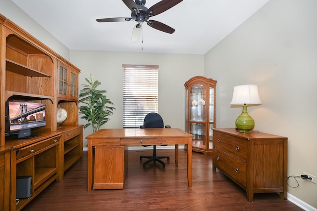 office with baseboards, dark wood-type flooring, and a ceiling fan