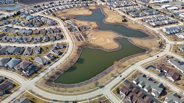 aerial view with a residential view and a water view