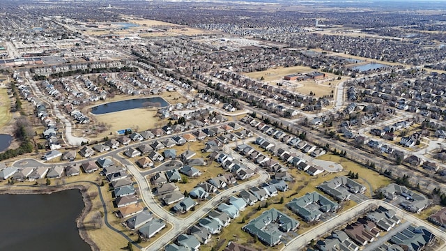 aerial view with a residential view and a water view