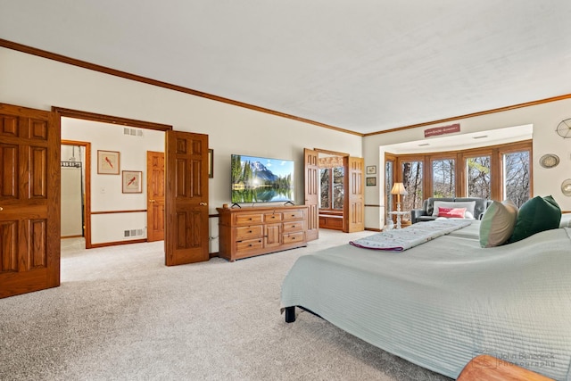 bedroom with crown molding, baseboards, visible vents, and light carpet