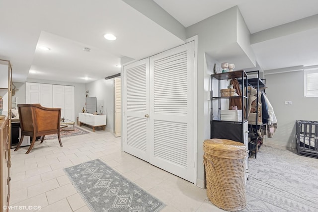 interior space with recessed lighting and baseboards