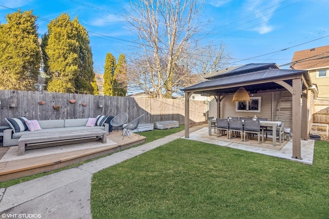 view of yard featuring a gazebo, a patio area, an outdoor living space, and a fenced backyard