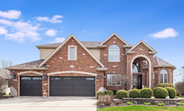 traditional-style home featuring brick siding and roof with shingles