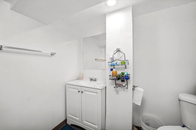 bathroom featuring toilet and vanity