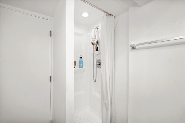 bathroom with a shower stall