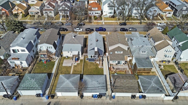 birds eye view of property with a residential view