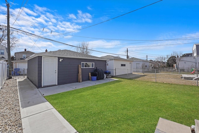 exterior space featuring an outdoor structure and a fenced backyard