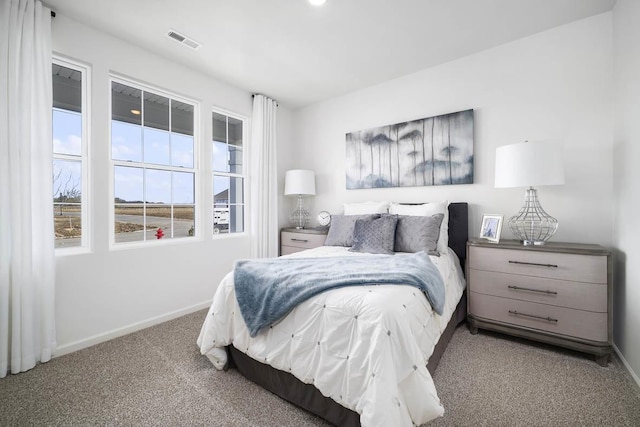 bedroom with visible vents, baseboards, and carpet floors