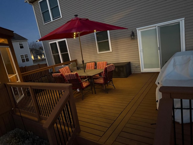 wooden deck with outdoor dining area