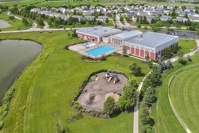 birds eye view of property featuring a residential view and a water view