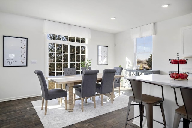 dining room featuring recessed lighting, dark wood-style floors, and baseboards