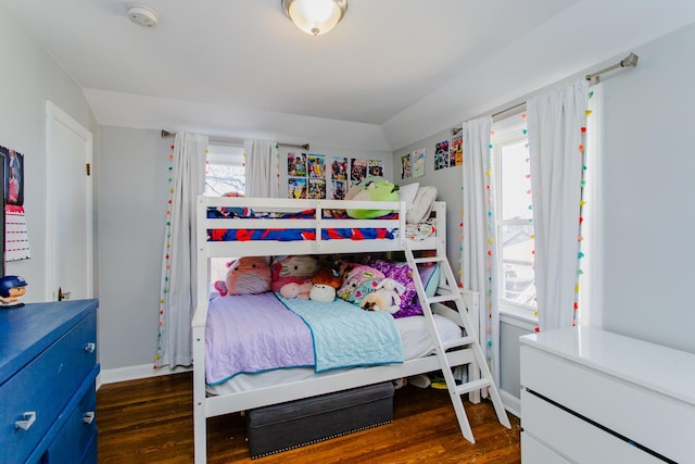 bedroom featuring wood finished floors and baseboards