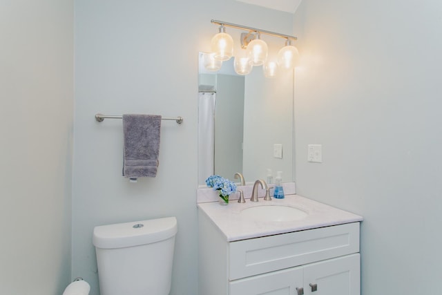 full bathroom featuring toilet and vanity