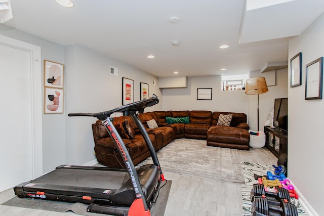 exercise room with visible vents, recessed lighting, baseboards, and wood finished floors