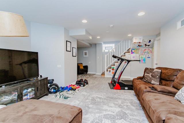 living room featuring recessed lighting, baseboards, and stairs