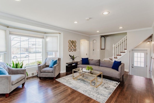 living room featuring recessed lighting, dark wood-type flooring, stairs, and crown molding