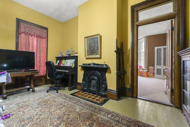 office space featuring hardwood / wood-style floors and baseboards