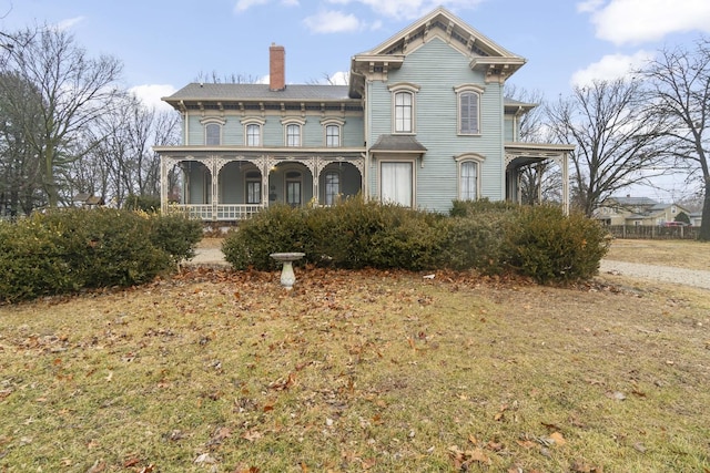 italianate house with covered porch and a chimney