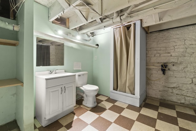 bathroom with vanity, tile patterned floors, curtained shower, and toilet