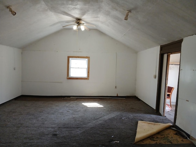 additional living space featuring lofted ceiling