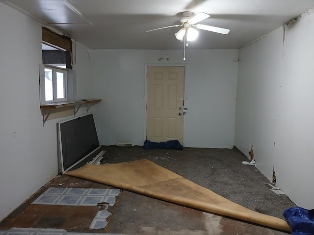 interior space featuring a ceiling fan