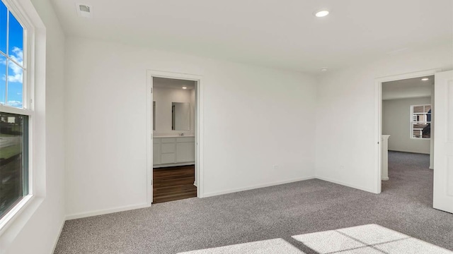 unfurnished room featuring recessed lighting, baseboards, and carpet floors