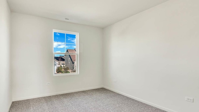 carpeted empty room with baseboards and visible vents