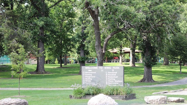 exterior space with a gazebo and a lawn