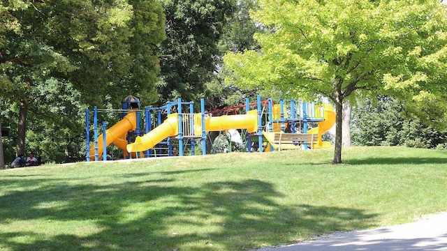 community playground featuring a lawn