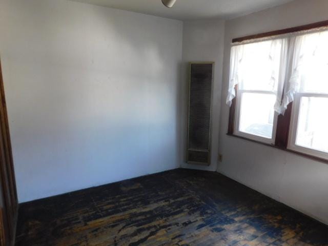 empty room with dark wood finished floors