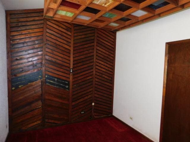 unfurnished room featuring carpet floors and coffered ceiling