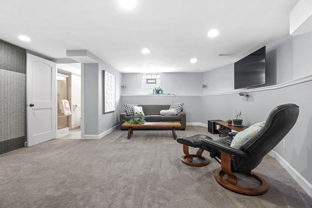 sitting room with recessed lighting, baseboards, and light carpet