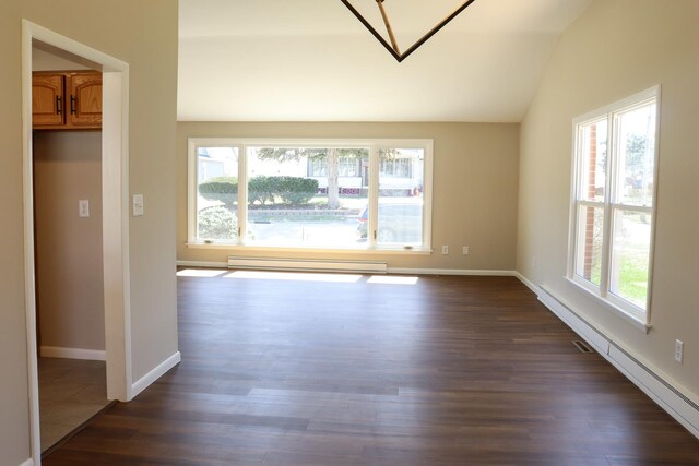 empty room with a baseboard heating unit, baseboards, and carpet