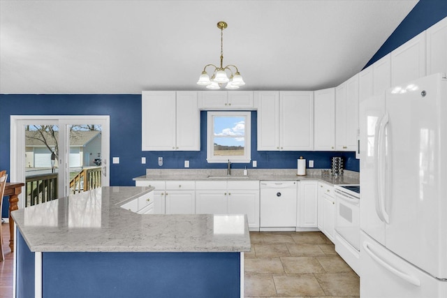 kitchen with white cabinets, a sink, an inviting chandelier, and white appliances