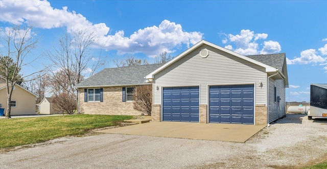 ranch-style home featuring brick siding, a front yard, a garage, and a shingled roof