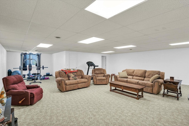 carpeted living room with visible vents and a paneled ceiling
