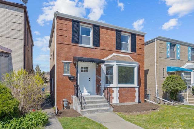 view of front facade featuring brick siding