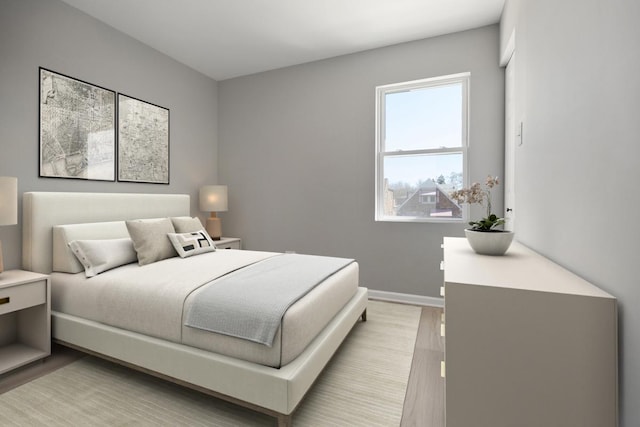 bedroom with baseboards and light wood-style floors