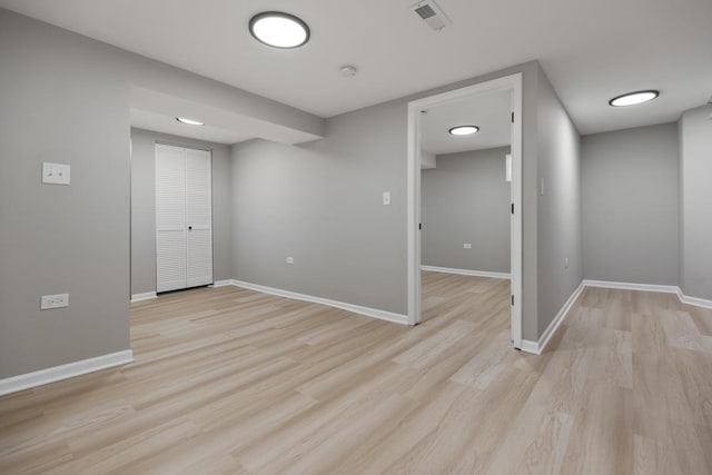 unfurnished room with visible vents, baseboards, and light wood-style floors