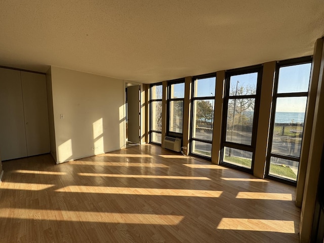 interior space with a wall mounted air conditioner