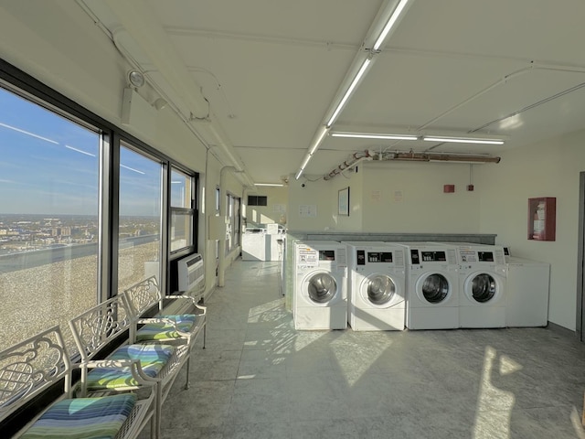 community laundry room featuring independent washer and dryer