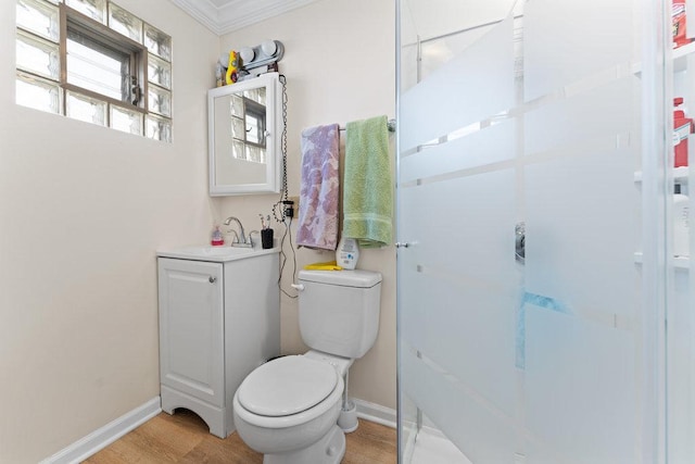 full bath with toilet, vanity, and baseboards