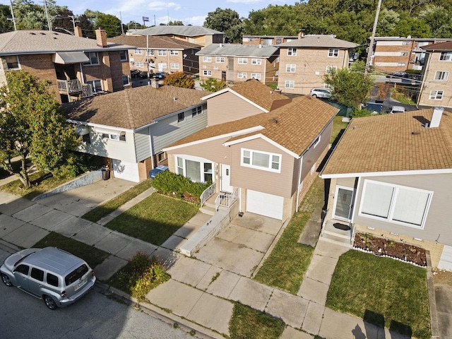 birds eye view of property with a residential view