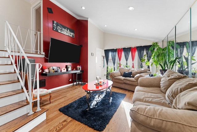 living area featuring stairway, recessed lighting, crown molding, and wood finished floors