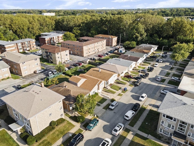 bird's eye view featuring a residential view and a forest view